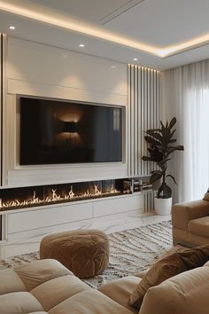 a living room with couches and a flat screen tv mounted on the wall above it