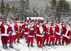 a large group of people dressed as santa claus