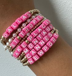 Say hello to our brand-new Destination Bracelets. These babies are all about fun and flaunting, dipped in hot pink color that's impossible to miss. Each bracelet rocks the names of our top-pick city spots and resort destinations.
This bracelets will not tarnish and you can wear this in the pool or sea.
3mm beads | Available in 6.5" or 9.5" (stretchy)
Please note that each piece is custom made with your city names and final sale. Pink Name Bracelet For Friendship, Custom Name Pink Stretch Bracelet, Custom Name Pink Adjustable Bracelets, Pink Stackable Beaded Bracelets For Summer, Custom Name Pink Stretch Bracelet For Friendship, Stackable Pink Beaded Bracelets For Summer, Trendy Pink Name Bracelet With Letter Beads, Casual Pink Bracelet With Custom Name, Casual Pink Bracelets With Custom Name