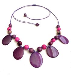 Taua Nut Necklace Necklace Length: 32 inches adjustable to shorter length Adjustable 16-inch Beaded Necklaces, Adjustable Long Purple Beaded Necklace, Purple Necklace With Adjustable Chain, Adjustable Purple Necklaces, Adjustable Purple Necklace, Eco Friendly Necklace, Tagua Necklace, Ivory Necklace, Tagua Jewelry