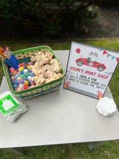 a table topped with a basket filled with lots of candy