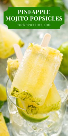 pineapple mojito popsicles in a glass with limes