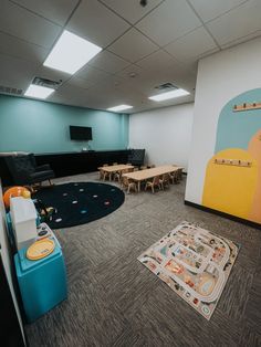 an empty room with children's play equipment in it