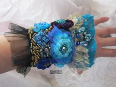 Elegant Embroidered Bracelets As A Gift, Elegant Embroidered Bracelets As Gift, Bohemian Embroidered Bracelets For Weddings, Bohemian Blue Cuff Bracelet, Bohemian Blue Cuff Bracelet For Party, Handmade Wearable Art Cuff Bracelet For Party, Handmade Bohemian Cuff Bracelet For Wedding, Handmade Blue Cuff Bracelet For Party, Handmade Cuff Bracelet For Wedding