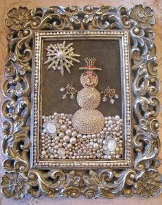 an ornate frame with a snowman on it