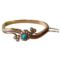 If the Victorian style makes your heart tremble, consider this Antique Victorian Bangle Bracelet in 14 K rose Gold featuring a natural Turquoise and seedpearls. The bangle secures with an integrated push fit catch to one side and benefits from the additional security of a fine link safety chain. Inner circumference: 19 cm Diameter: 6 cm Masterfully handcrafted piece! Authenticity and money back is guaranteed. For any enquires, please contact the seller through the message center. Elegant Turquoise Bangle For Wedding, Message Center, K Rose, Safety Chain, Antique Roses, Natural Turquoise, Victorian Style, Antique Victorian, Victorian Fashion