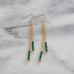 Gold-plated double chain earrings are adorned with your choice of beautiful gemstone or gold beads for a chic minimalist look. + gold-plated double chain earrings with gemstone beads+ gold-plated stainless steel ear wire hooks (lead-free and nickel-free)+ available with Amazonite, Moonstone, Malachite, Pyrite, Black Spinel, Multi-colored Moonstone, or Rainbow Moonstone semi-precious gemstone beads or anti-tarnish gold-plated nugget beads+ 3.5" long (each piece is handmade so lengths are approxim Cheap Bohemian Beaded Chain Earrings, Affordable Gold Beaded Chain Earrings, Metal Drop Earrings With Beaded Chain, Gold Beaded Chain Drop Earrings, Bohemian Beaded Chain Earrings, Gold Chain Earrings, Beaded Earrings Diy, Homemade Jewelry, Handmade Jewelry Diy