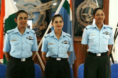 three women in uniform standing next to each other