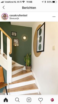 the stairs in this house have been painted green and white with wood trimmings