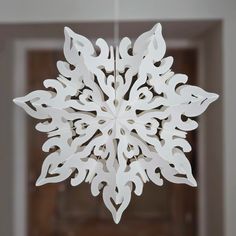 a paper snowflake hanging from the ceiling