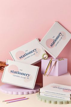 three stationery boxes sitting on top of each other