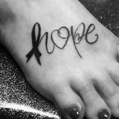 a black and white photo of a person's foot with the word hope written on it