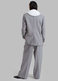 Color: Grey Midweight woven suiting fabric Relaxed silhouette Notch lapel Slightly padded shoulders Button cuffs Front flap pockets Vented back Front button closure Lined 56% Polyester 24% Rayon 18% Wool 2% Spandex Dry Clean Imported Workwear Pantsuit With Pockets And Suit Collar, Workwear Pantsuit With Welt Pockets And Suit Collar, Lapel Collar Pantsuit With Pockets For Work, Tailored Office Pantsuit With Pockets, Tailored Business Pantsuit With Pockets, Office Wear Pantsuit With Notch Lapel And Welt Pockets, Gray Single-breasted Suit For Work, Gray Single Breasted Suit For Workwear, Business Pantsuit With Suit Collar And Pockets