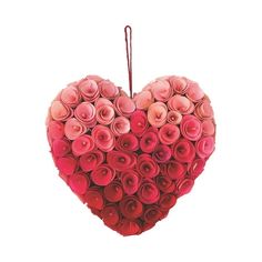 a heart shaped arrangement of pink roses hanging from a string on a white background with room for text