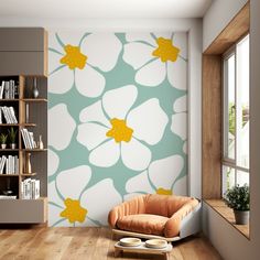 a living room with a chair, book shelf and flower wallpaper on the walls