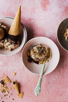 three bowls filled with ice cream on top of a pink table