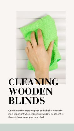 a hand with a green cloth on top of it and the words cleaning wooden blinds