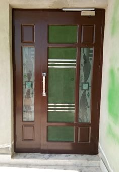 a brown door with glass panels on it