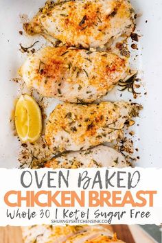 oven baked chicken breast with lemon wedges and herbs