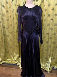 Very detailed purple silk dress in good condition  Size -  Waist 28 inches  Length of skirt - 40 inches  Sleeve - 22.5 inch Vintage Long Sleeve Satin Dresses, Elegant Silk Vintage Dress For Party, Elegant Silk Vintage Party Dress, Vintage Silk Formal Dresses, Elegant Long Purple Dresses, Purple Satin Formal Dress, Purple Party Dress With Bias Cut, Purple Bias Cut Dress For Party, Purple Bias Cut Party Dress