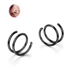 two pairs of black metal hoop earrings on a white background with a nose ring in the middle