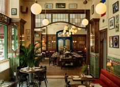 the inside of a restaurant with tables and chairs