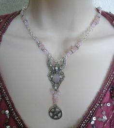 "This beautiful necklace has rose quartz nugget beads, rose quartz beads, pink Czech glass beads, pewter silver accent beads, metal chain, sterling silver plated filigree crescent moon pendant with rose quartz stone, rhinestones and a pewter silver pentacle. It is 18\" long. Sterling silver plated toggle clasp." Bohemian Silver Rose Quartz Necklaces, Bohemian Silver Rose Quartz Necklace, Bohemian Silver Necklace With Rose Quartz, Wicca Jewelry, Wiccan Necklace, New Plymouth, Wiccan Jewelry, Crescent Moon Pendant, Pagan Jewelry