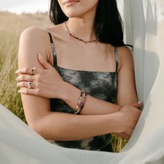 The Cherry Blossom necklace evokes the whimsical beauty of its namesake with a cascade of hand-strung beads. Each one meticulously chosen, delicate pink tourmaline mingles with auralite, labradorite, and deep amethyst, creating a gradient of pinks and purples. Vivid pink tourmaline faceted droplets add a touch of playful sparkle, reminiscent of cherry trees in full bloom. DETAILS: Hand strung beaded necklace 16” length with 1” extender chain Gold-filled chain and clasp Pink tourmaline, auralite, Pink Bohemian Jewelry For Everyday Wear, Bohemian Tourmaline Bead Jewelry, Bohemian Tourmaline Round Beads Jewelry, Pink Tourmaline Bohemian Jewelry, Bohemian Beaded Tourmaline Jewelry, Adjustable Tourmaline Gemstone Beads Jewelry, Adjustable Ethereal Gemstone Jewelry, Energy Connection, Cherry Blossom Necklace