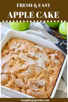 fresh and easy apple cake with powdered sugar on top in a white baking dish