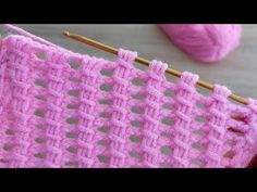 a pink crochet stitch being worked on