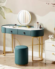 a dressing table with a mirror and stool next to it