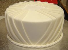 a white cake sitting on top of a table