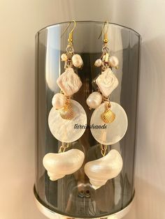 Seashell,mother of pearl and baroque pearl gold plated earrings✨ All gold looking pieces are gold plated. You can wear this chic earrings every day💞 *Please try not to wear your jewelry while exercising, in shower or while sleeping .  *Also , is best to keep away from chemicals, lotions or strong perfumes . Cleaning them with a simple polished cloth is ideal .  FAST FREE SHIPPING! If you have any questions feel free to contact💌 Love from tarcinshands! Elegant Gold Pearl Earrings For Summer, Elegant Shell-shaped Earrings For Vacation, White Shell Pearl Drop Earrings, Elegant Dangle Earrings For Vacation, Elegant Pearl Earrings For The Beach, Elegant Pearl Earrings For Summer Beach, Elegant Shell Earrings For Vacation, Elegant Drop Earrings For Vacation, Elegant Handmade Pearl Earrings For Beach