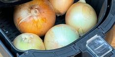 onions are sitting in an air fryer and ready to be cooked