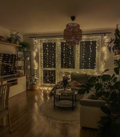 a living room filled with furniture and lots of christmas lights on the windows sill