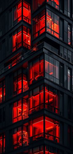 red lights are shining on the windows of an apartment building in london, england at night