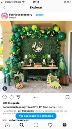 an image of a party with balloons and greenery on the wall in front of it