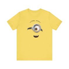 This Dave the minion T-Shirt is a fun and quirky addition to any casual outfit. It offers a retail fit and a classic crew neckline, making it suitable for both casual and semi-formal settings. Made with 100% Airlume combed and ring-spun cotton, this lightweight tee is perfect for active and leisure wear. The tear-away label minimizes skin irritations, and the fabric blends ensure durability and comfort. Ideal for minion fans and anyone looking to add a touch of whimsy to their wardrobe. Product Minion T Shirt, Minions Fans, Despicable Me, Leisure Wear, Casual Outfit, Semi Formal, Minion, Crew Neckline, Graphic Tee