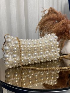 Pearl Bead Bag | Pearl Clutch Bag | Pearl Handbag  ✨ Elevate your style with this handmade white pearl bead bag, combining elegance and sophistication. 🌟 Perfect for weddings, parties, and special events, this bag is a must-have accessory that adds a touch of glamour to any outfit. 💍 - Crafted with high-quality pearl beads for a luxurious look ✨ - Durable and stylish, designed to last 💎 - Ideal for special occasions and formal events 🎉 - Dimensions: [10 cm x 22 cm - (3,93 inch x 8,66 inch) Trendy Beaded Clutch Shoulder Bag, Beaded Beige Bags For Party, Beaded Shoulder Bag Clutch, Beige Beaded Bags For Party, Chic Pearl Clutch For Gift, Chic Pearl Clutch As Gift, Handheld Clutch With Pearl Handle, Chic Beaded Handheld Clutch, Chic Rectangular Clutch With Pearl Embroidery