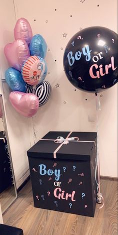 a boy or girl gift box and balloons