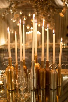 an instagram page with candles and wine bottles on the table in front of them