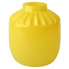 a yellow vase sitting on top of a white table