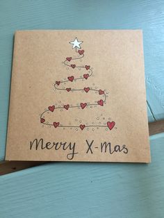 a card with a christmas tree drawn on it and the words merry x - mas