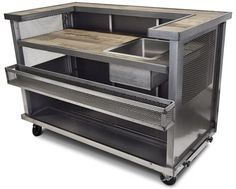 an industrial style kitchen cart with drawers and cupboards