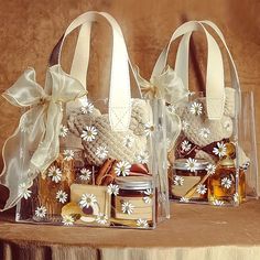 two clear bags filled with different types of items sitting on top of a wooden table