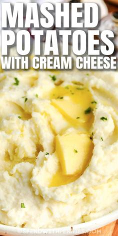 mashed potatoes with cream cheese in a white bowl on a wooden table and text overlay that reads mashed potatoes with cream cheese