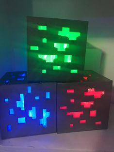 two cubes with different colored lights on them