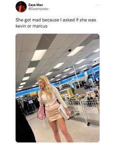 a woman is standing in an airport with her hand on her hip