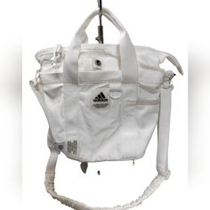 This Adidas Mini Tote Is Just The Right Size To Hold Your Keys, Wallet, Mobile When You Head To The Gym. Two Ways To Wear, As Satchel Or As Crossbody Zippered Valuable Pocket To Hold Your Phone And Small Stuff Nwot Approx Dimensions "10h X 11"W X 4.5"D Bundle & Save More $$$, Check Out My Other Gorgeous Collection From My Closet With Beautiful Style, Great Quality & Affordable Prices Adjustable Crossbody Strap Up To 25" Adidas Belt Bag, Adidas Bags, Convertible Crossbody Bag, Small Stuff, Small Backpack, Mini Tote, Mini Crossbody, White Adidas, Green Bag