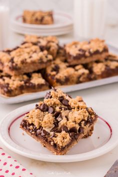 chocolate chip cookie bars sitting on top of a white plate